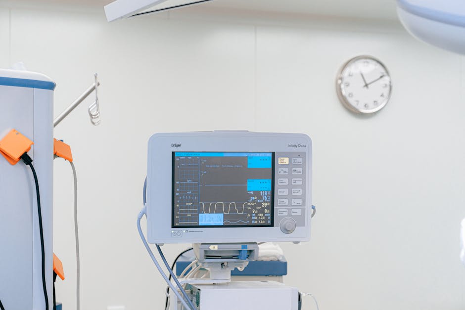 A modern heart rate monitor in a sterile hospital setting, showcasing medical technology.